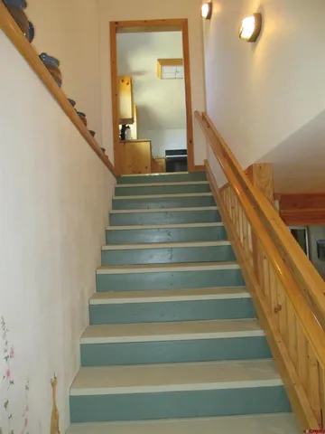 a kitchen with cabinets appliances and a window