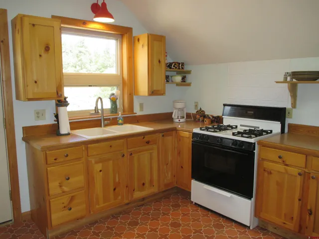 a view of a yard with a wooden fence