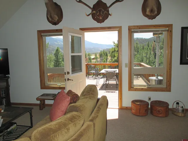 a view of a two chairs on the roof deck