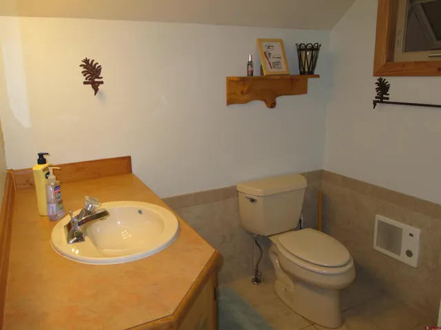 a view of a livingroom with furniture and a window