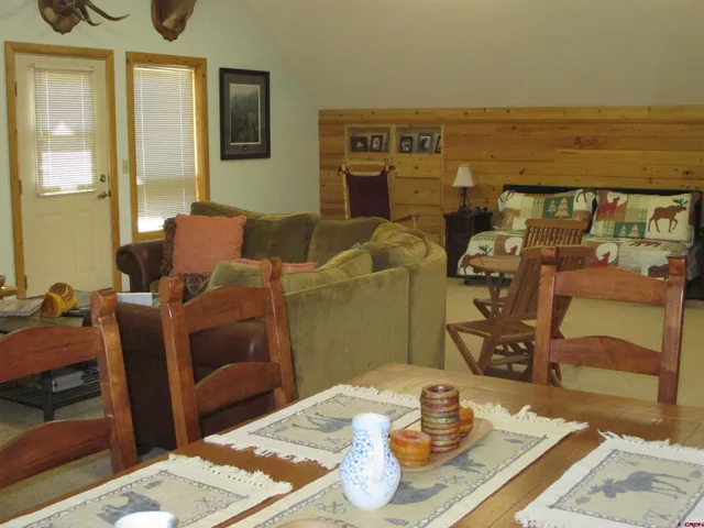 a front view of house with yard and car parked