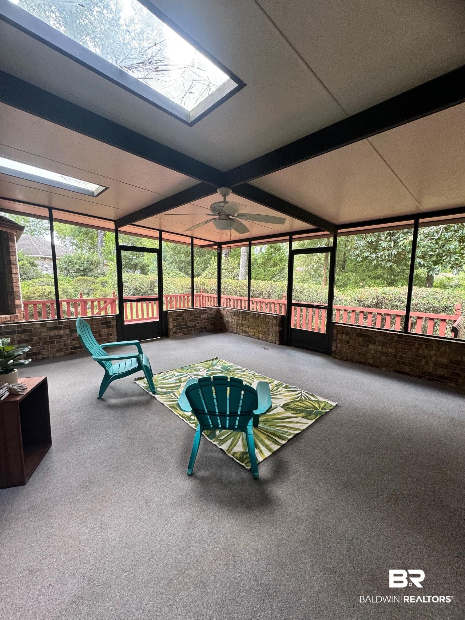 2240 Perdido Circle Lillian, AL 36549 - Photo 14 of 42 Sunroom with beam ceiling, ceiling fan, and a skylight