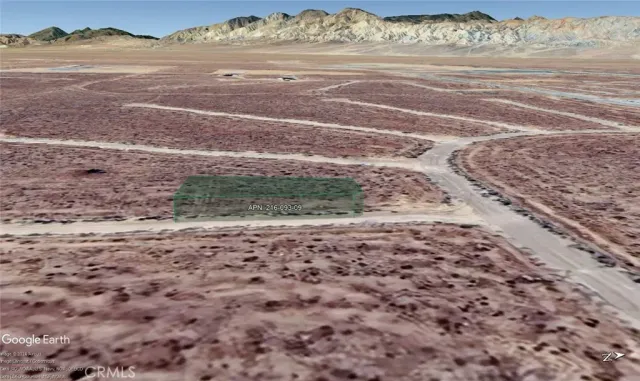 a view of a dry yard with wooden floor