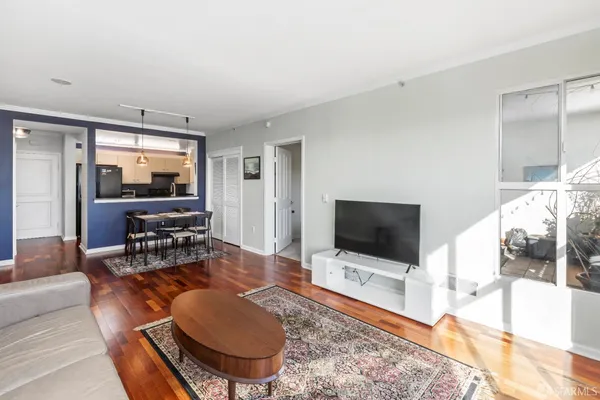 a living room with furniture and a flat screen tv