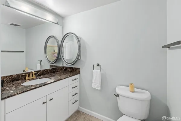 a bathroom with a shower and toilet