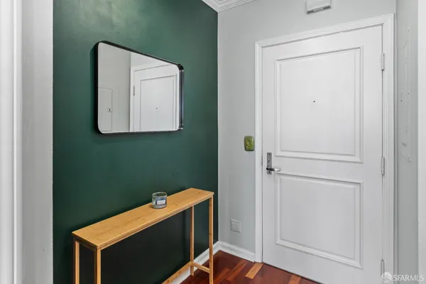a room with a door and a mirror
