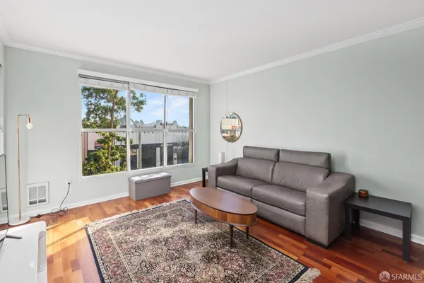 a living room with furniture and a rug