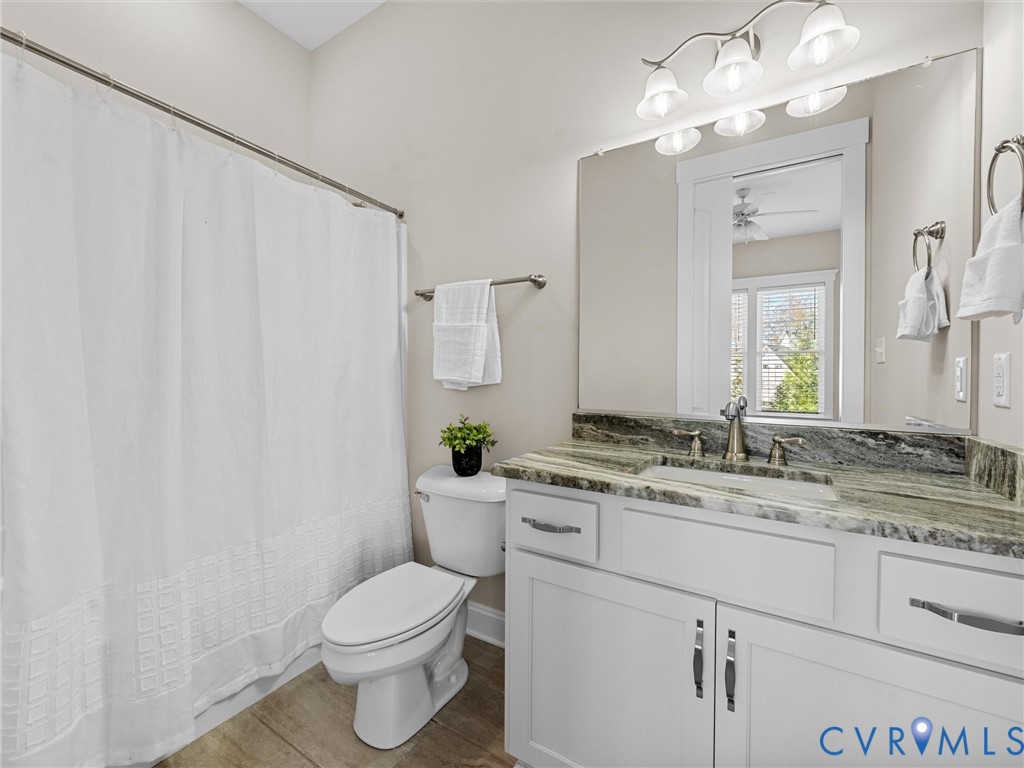 2001 Tulip Hill Drive Midlothian, VA 23112 - Photo 26 of 50 a bathroom with a granite countertop sink a toilet and a mirror