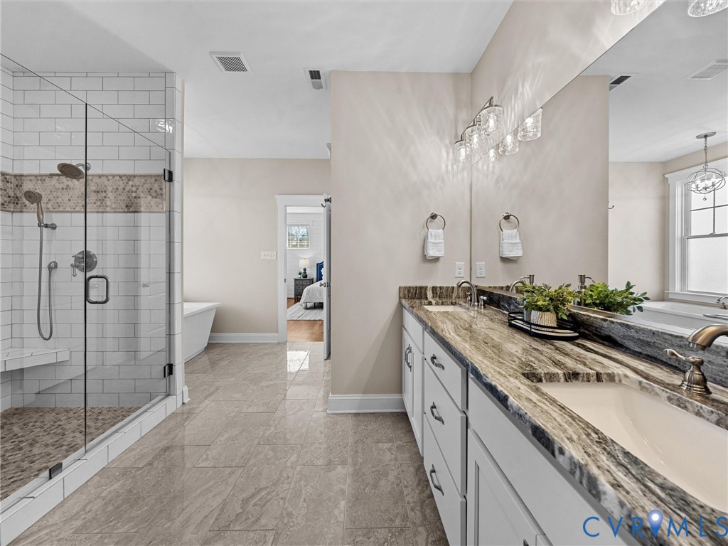2001 Tulip Hill Drive Midlothian, VA 23112 - Photo 33 of 50 a spacious bathroom with a double vanity sink mirror and shower