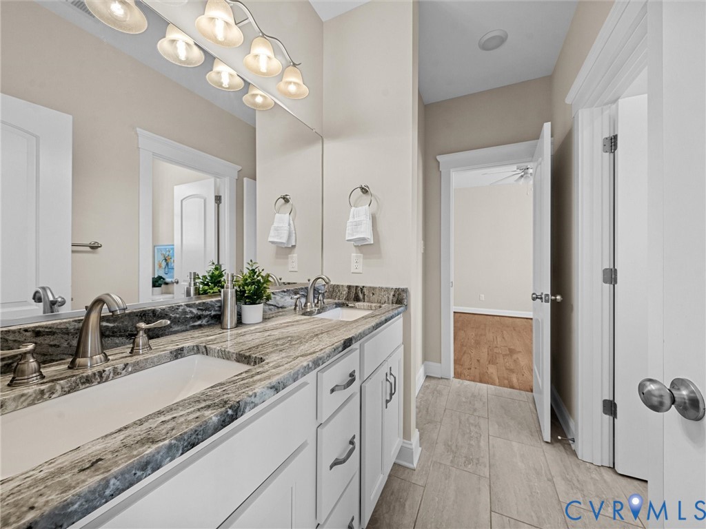 2001 Tulip Hill Drive Midlothian, VA 23112 - Photo 39 of 50 a bathroom with a sink double vanity granite and a mirror