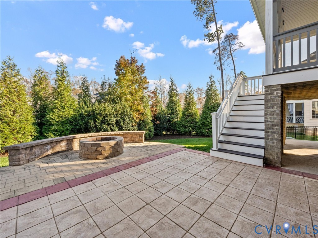2001 Tulip Hill Drive Midlothian, VA 23112 - Photo 47 of 50 a view of swimming pool with seating space and trees in the background