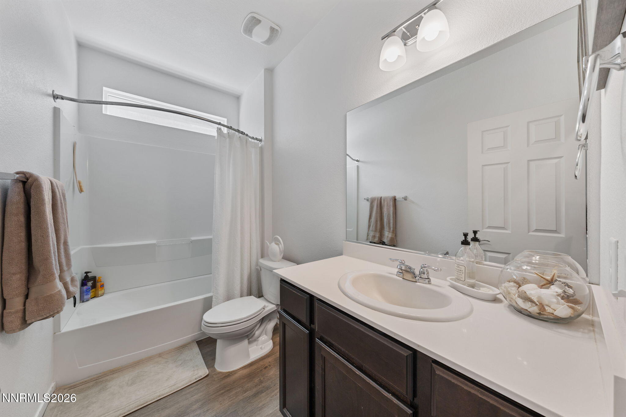 9708 Sea Glass Drive Reno, NV 89506 - Photo 8 of 51 a bathroom with a granite countertop sink toilet and shower