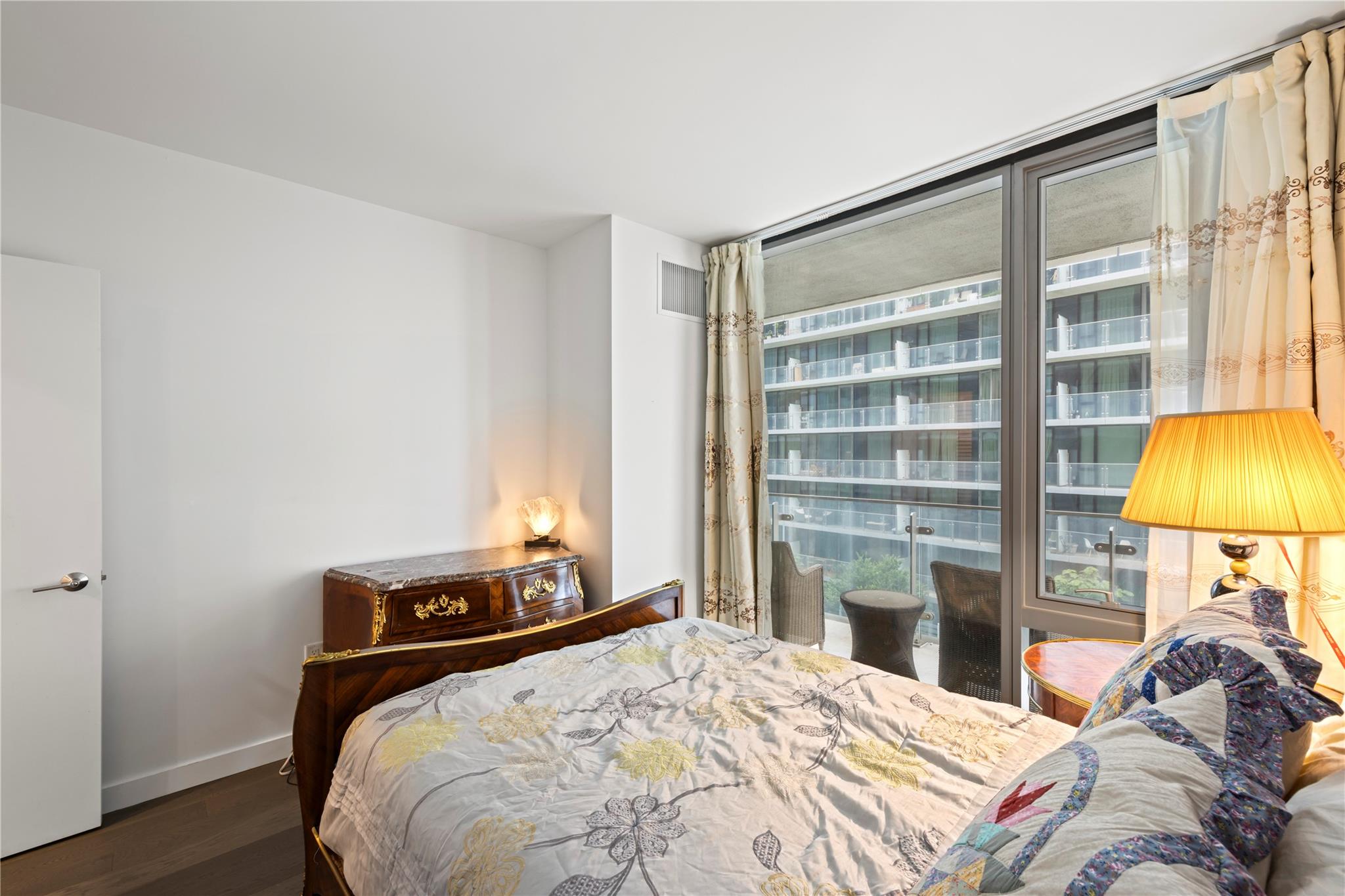 131-05 40 Road, Unit 11M Queens, NY 11354 - Photo 18 of 24 Bedroom featuring wood finished floors and baseboards