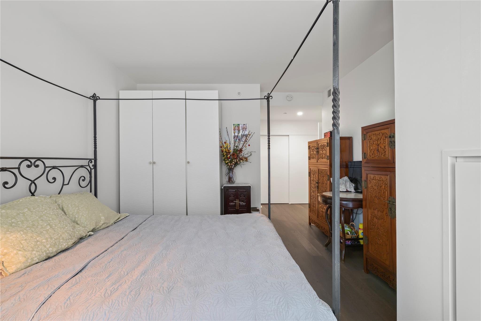 131-05 40 Road, Unit 11M Queens, NY 11354 - Photo 21 of 24 Bedroom featuring wood finished floors