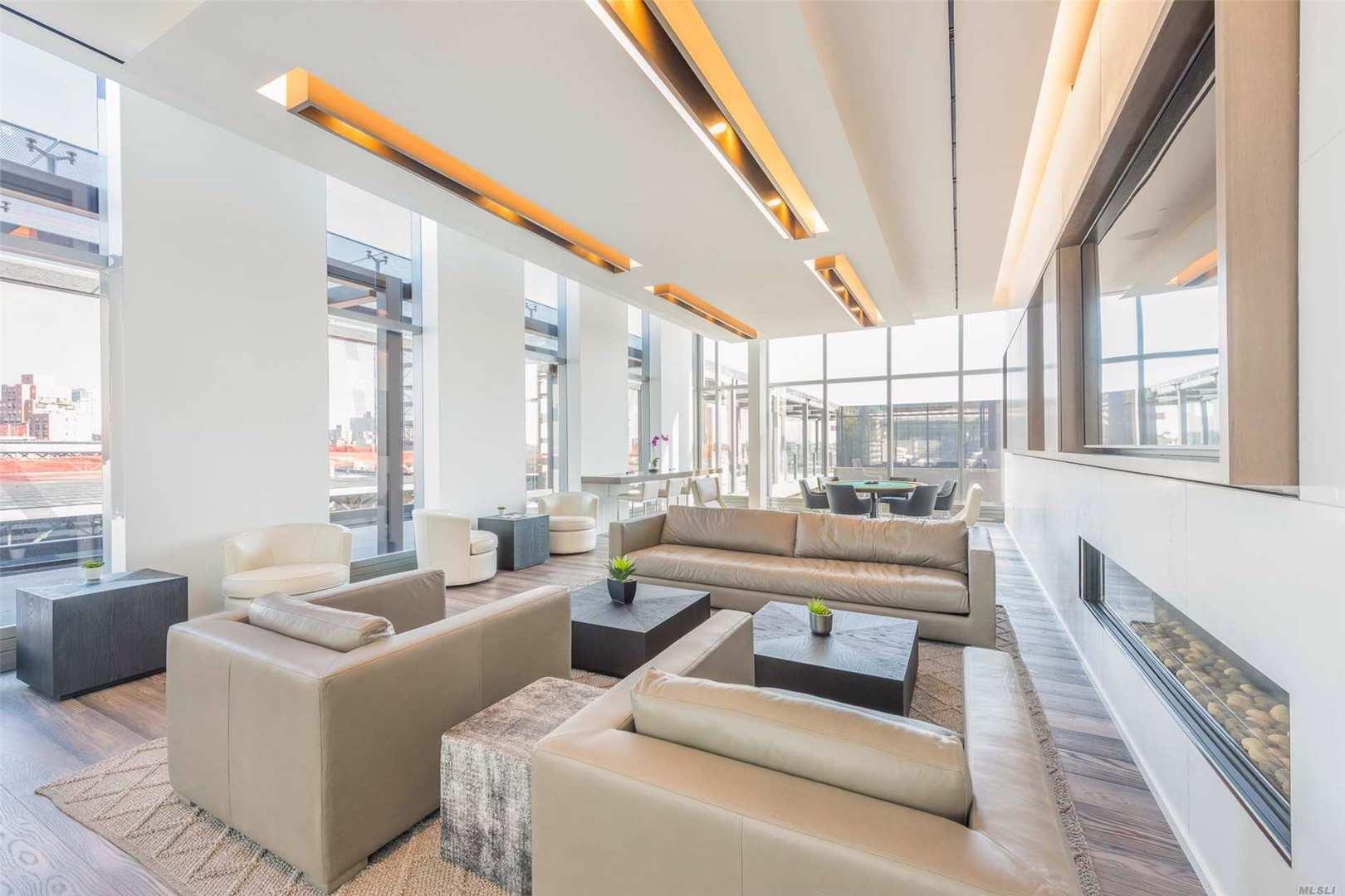 131-05 40 Road, Unit 11M Queens, NY 11354 - Photo 5 of 24 Community lobby with a wall of windows