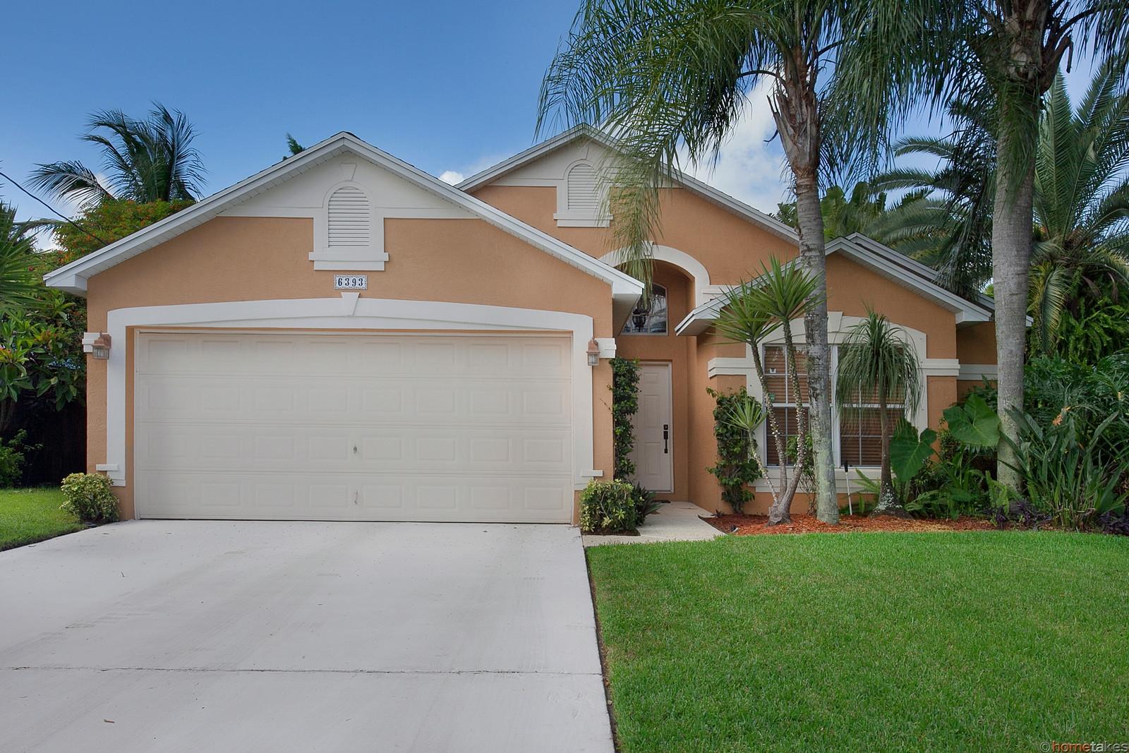 6393 Pompano Street Jupiter, FL 33458 - Photo 2 of 20 1 front of house