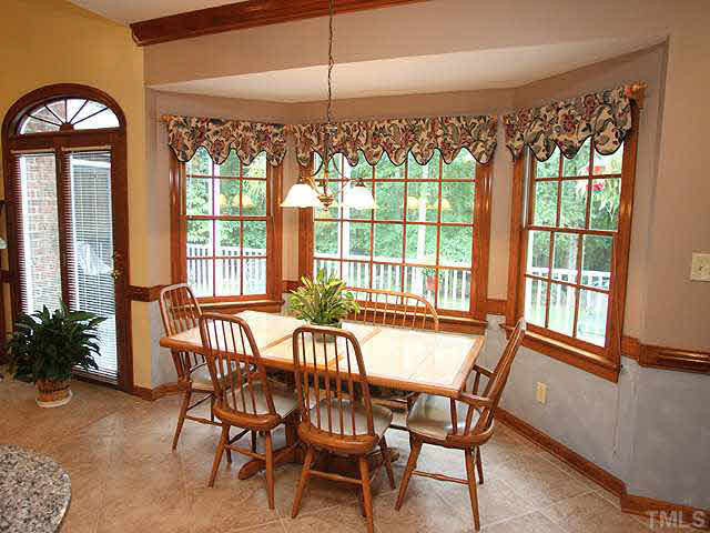 4020 Ridgebrook Bluffs Drive Raleigh, NC 27603 - Photo 6 of 14 Large informal dining area over looks deck & beautiful private landscaped backyard. Breakfast Area