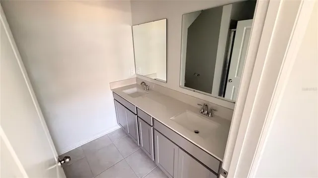 a bathroom with a sink and mirror