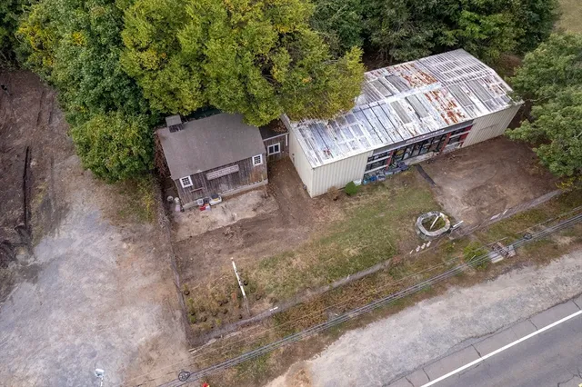 a view of an outdoor sitting area with brick wall