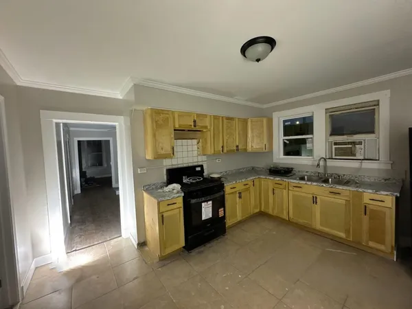 a kitchen with stainless steel appliances granite countertop a stove and a sink