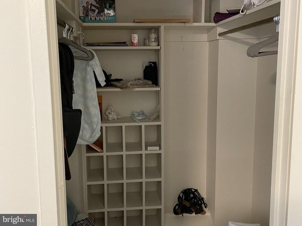 4000 Tunlaw Road Northwest, Unit 516 Washington, DC 20007 - Photo 11 of 35 a view of walk in closet with clothes and shoes