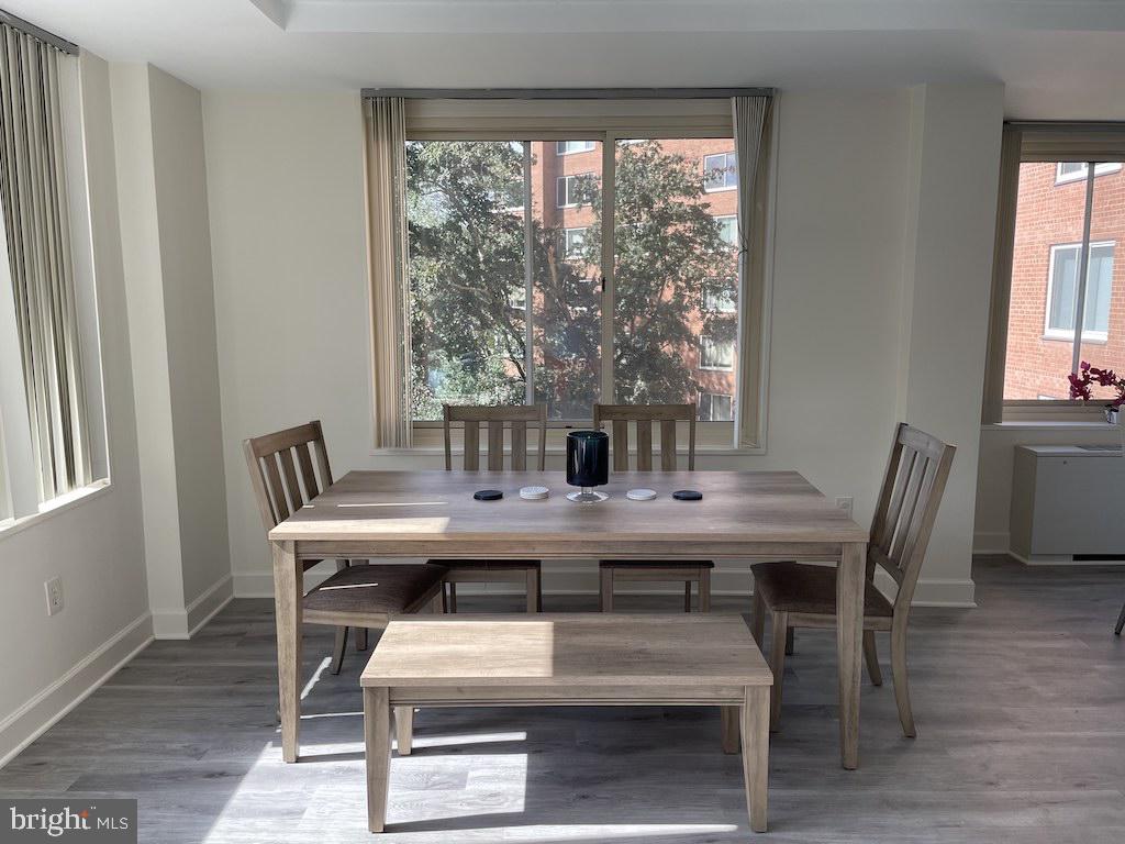 4000 Tunlaw Road Northwest, Unit 516 Washington, DC 20007 - Photo 3 of 35 a view of a dining room with furniture and wooden floor