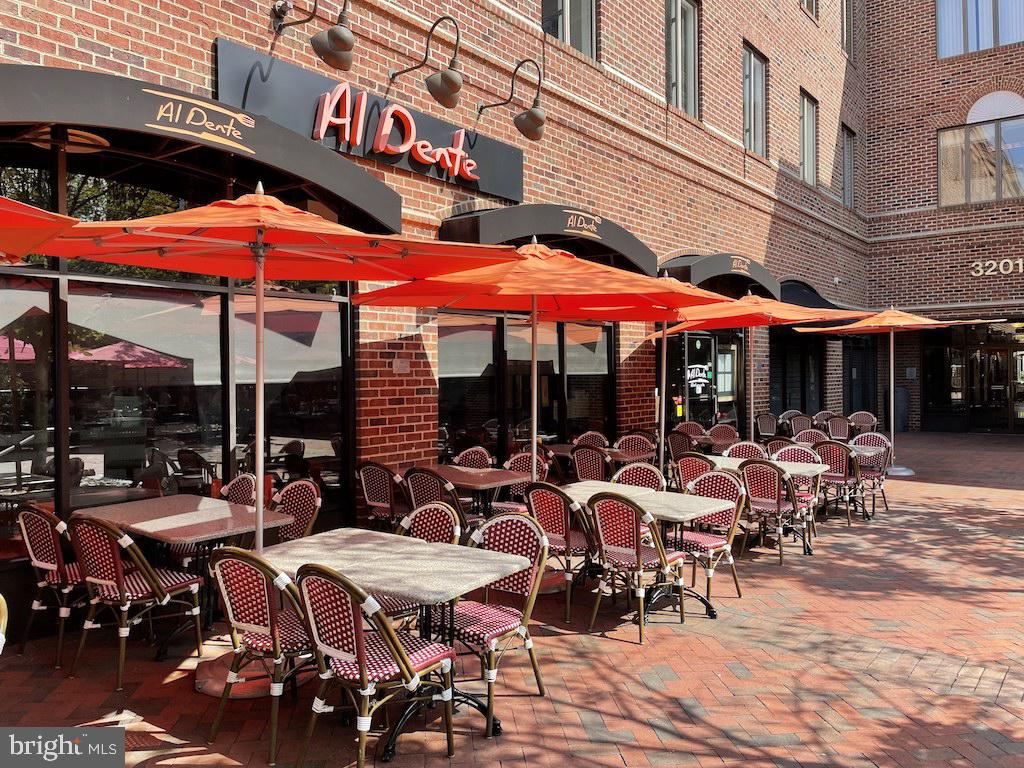 4000 Tunlaw Road Northwest, Unit 516 Washington, DC 20007 - Photo 33 of 35 a group of tables and chairs sitting in front of cafe
