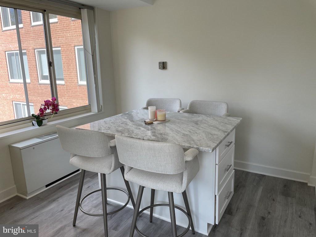4000 Tunlaw Road Northwest, Unit 516 Washington, DC 20007 - Photo 4 of 35 a view of a dining table and chairs in a room
