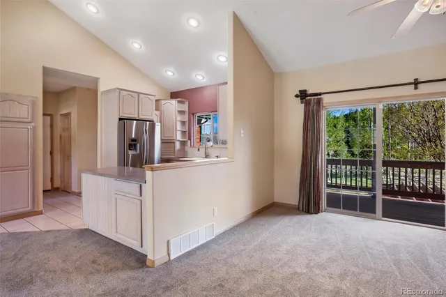 a view of livingroom with furniture and refrigerator