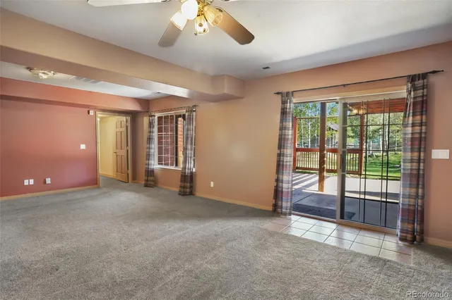 a view of an empty room with glass door