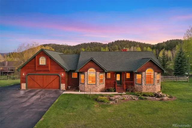 a front view of a house with a yard and pathway