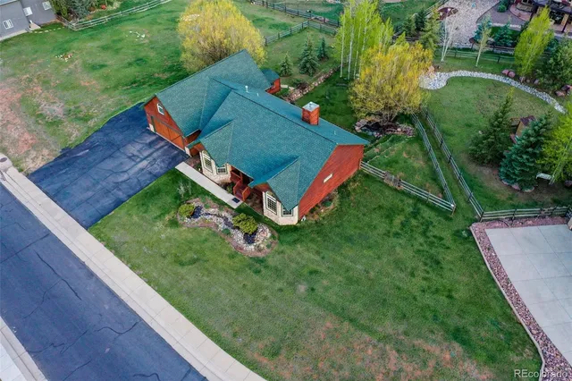 a view of a backyard with sitting area