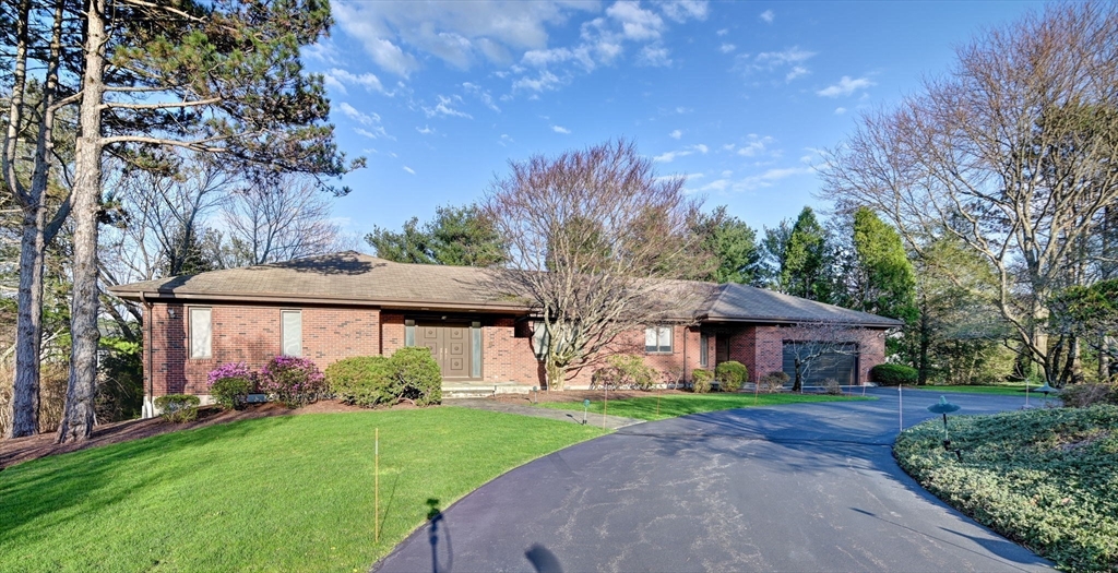 14 Seneca Road Canton, MA 02021 - Photo 1 of 42 a front view of a house with garden