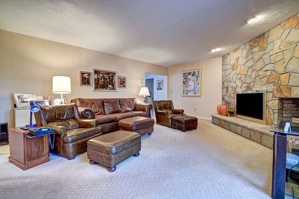 14 Seneca Road Canton, MA 02021 - Photo 15 of 42 a living room with furniture and a flat screen tv