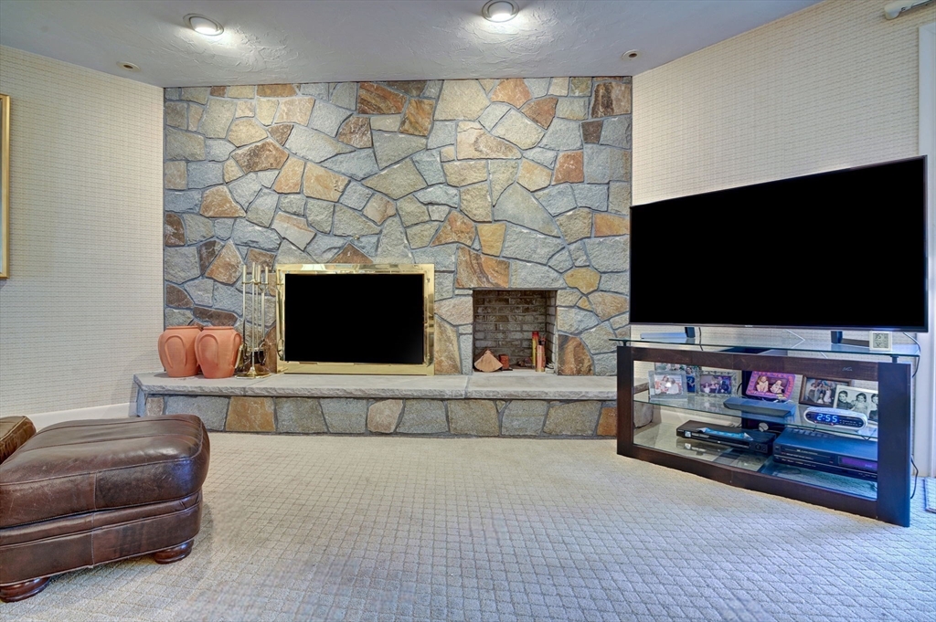 14 Seneca Road Canton, MA 02021 - Photo 16 of 42 a living room with furniture and a flat screen tv