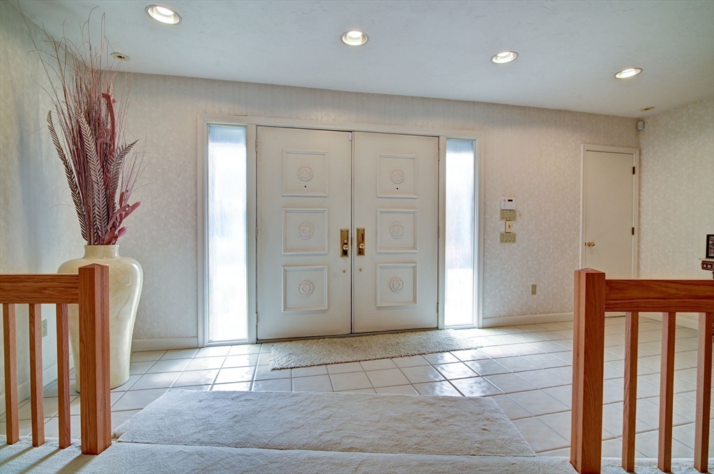 14 Seneca Road Canton, MA 02021 - Photo 20 of 42 a view of a hallway with wooden floor and stairs