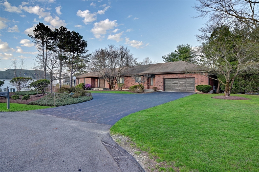 14 Seneca Road Canton, MA 02021 - Photo 3 of 42 a front view of a house with garden
