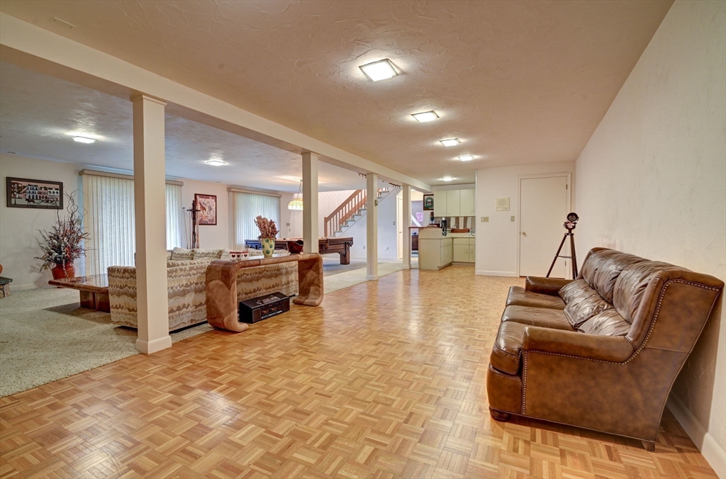 14 Seneca Road Canton, MA 02021 - Photo 35 of 42 a living room with furniture and a flat screen tv