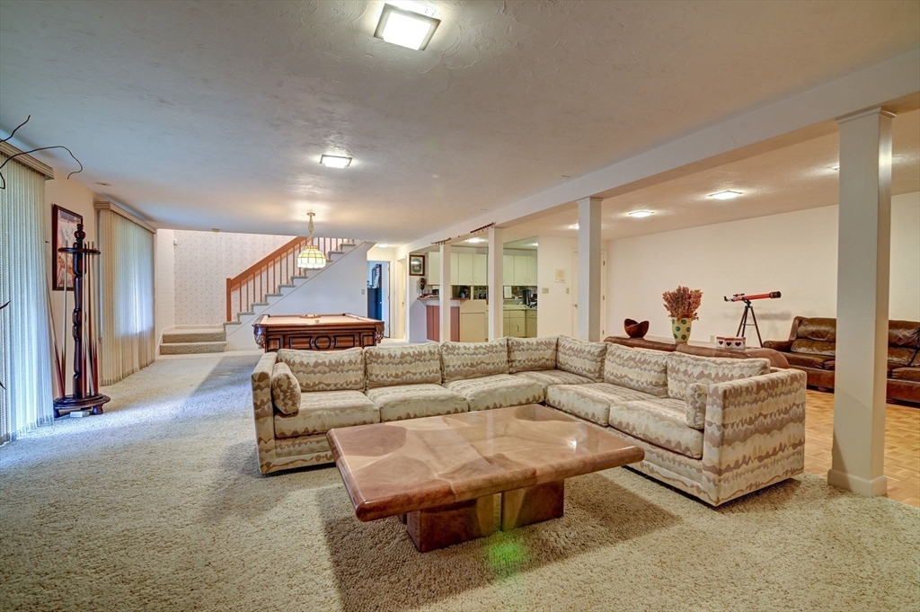 14 Seneca Road Canton, MA 02021 - Photo 36 of 42 a living room with furniture and a wooden floor