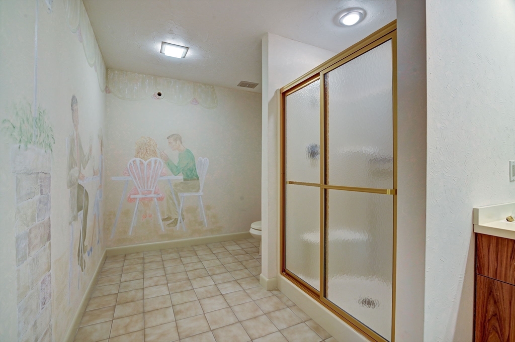 14 Seneca Road Canton, MA 02021 - Photo 41 of 42 a bathroom with a glass shower door