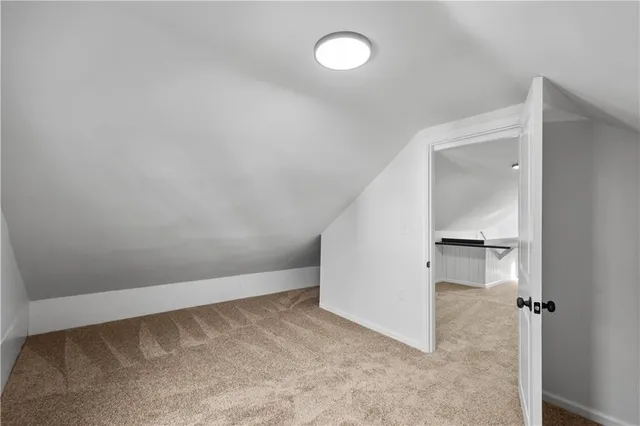 a view of a balcony with wooden floor