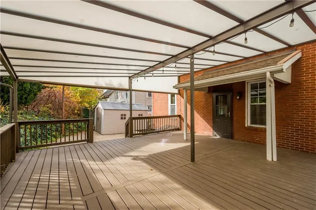 a view of a small house with backyard