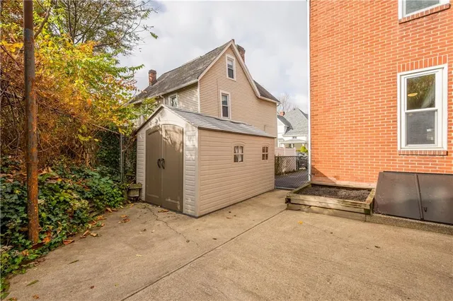 an aerial view of residential building and trees around