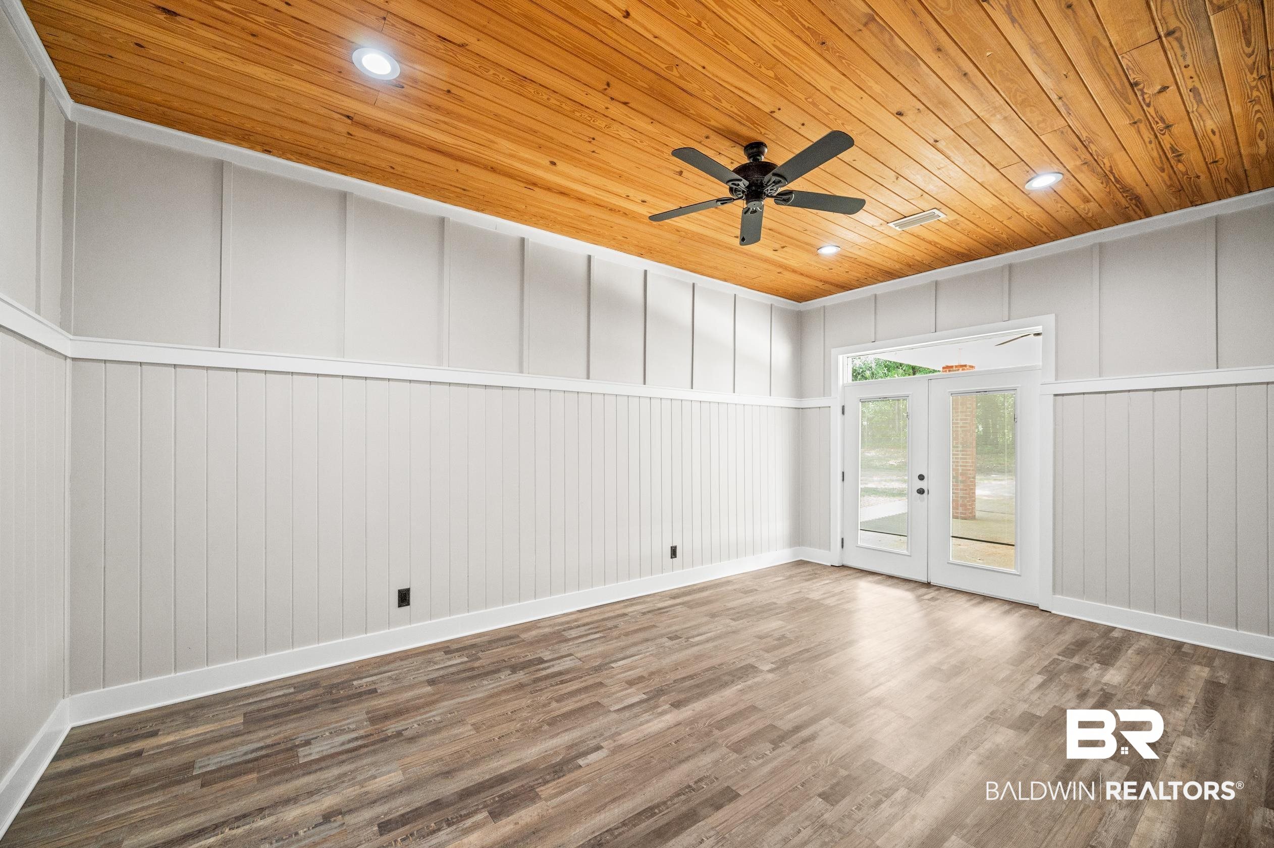 15031 Timber Ridge Drive Loxley, AL 36551 - Photo 27 of 43 Spare room with ceiling fan, hardwood / wood-style flooring, french doors, and wood ceiling