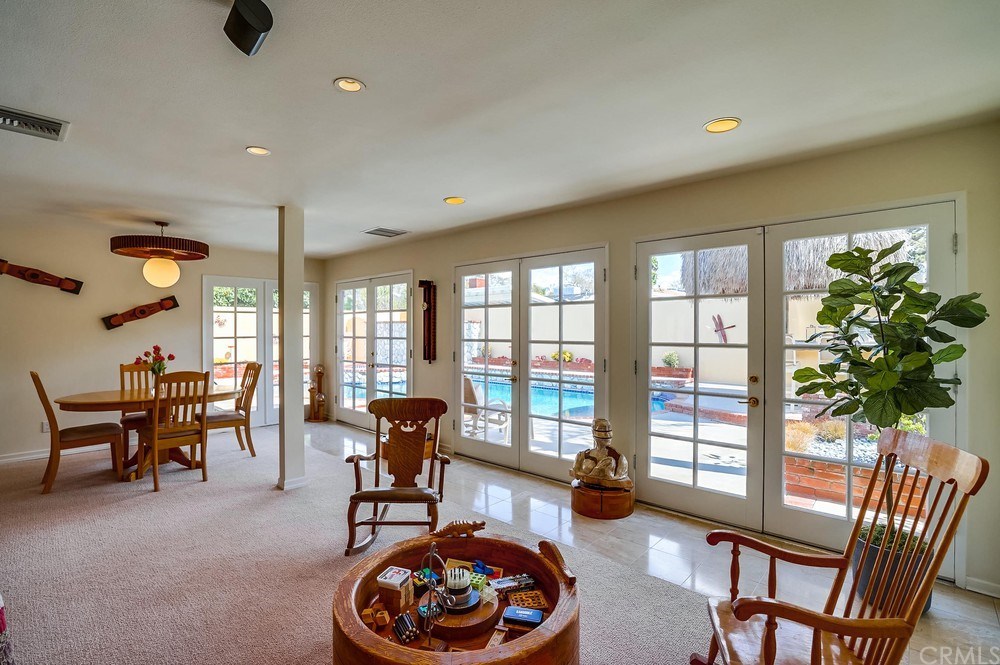 460 Peralta Avenue Long Beach, CA 90803 - Photo 11 of 42 The wall of french doors allows so much light into this room...imagine opening them up in the summer for complete indoor/outdoor entertaining!