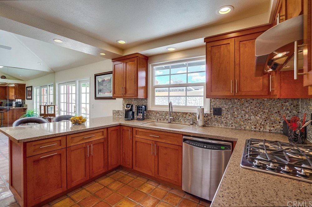 460 Peralta Avenue Long Beach, CA 90803 - Photo 14 of 42 The kitchen has been completely remodeled with quartz countertops, shaker cabinets, & GE Profile appliances