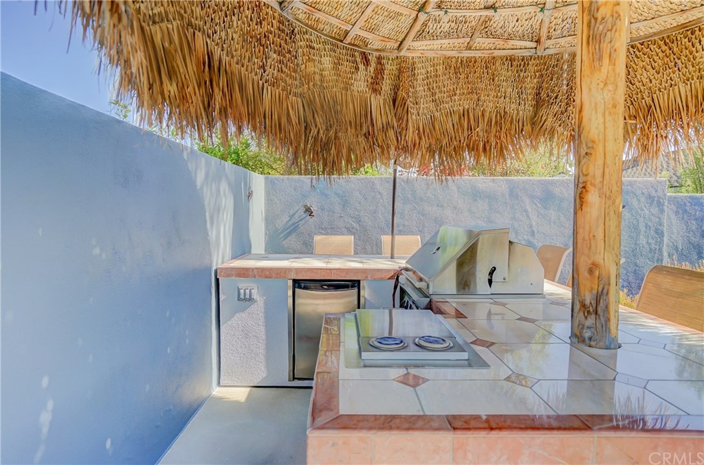 460 Peralta Avenue Long Beach, CA 90803 - Photo 33 of 42 BBQ area has a built in fridge & burners & seating for 6 people