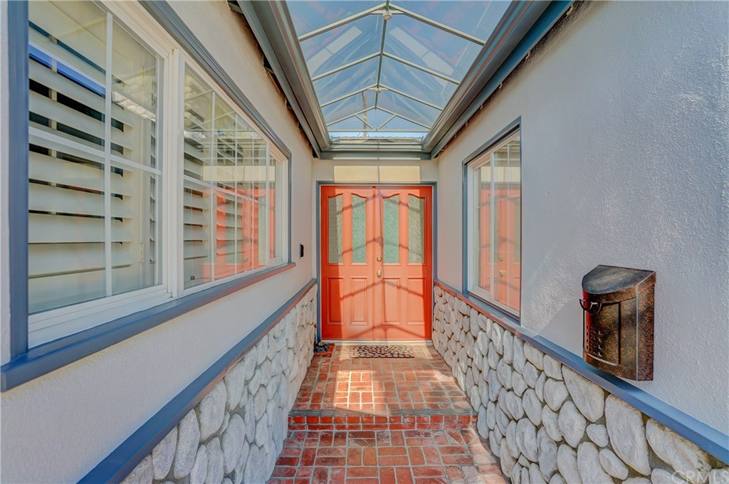460 Peralta Avenue Long Beach, CA 90803 - Photo 5 of 42 Owners had the covered walkway specially made to help keep the rain, leaves, etc from the entrance of the home