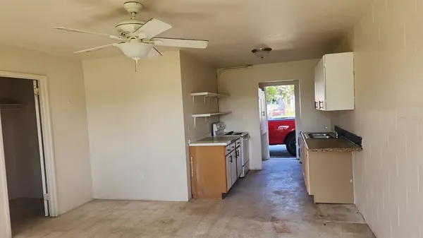 a kitchen with a refrigerator a stove top oven a sink and dishwasher