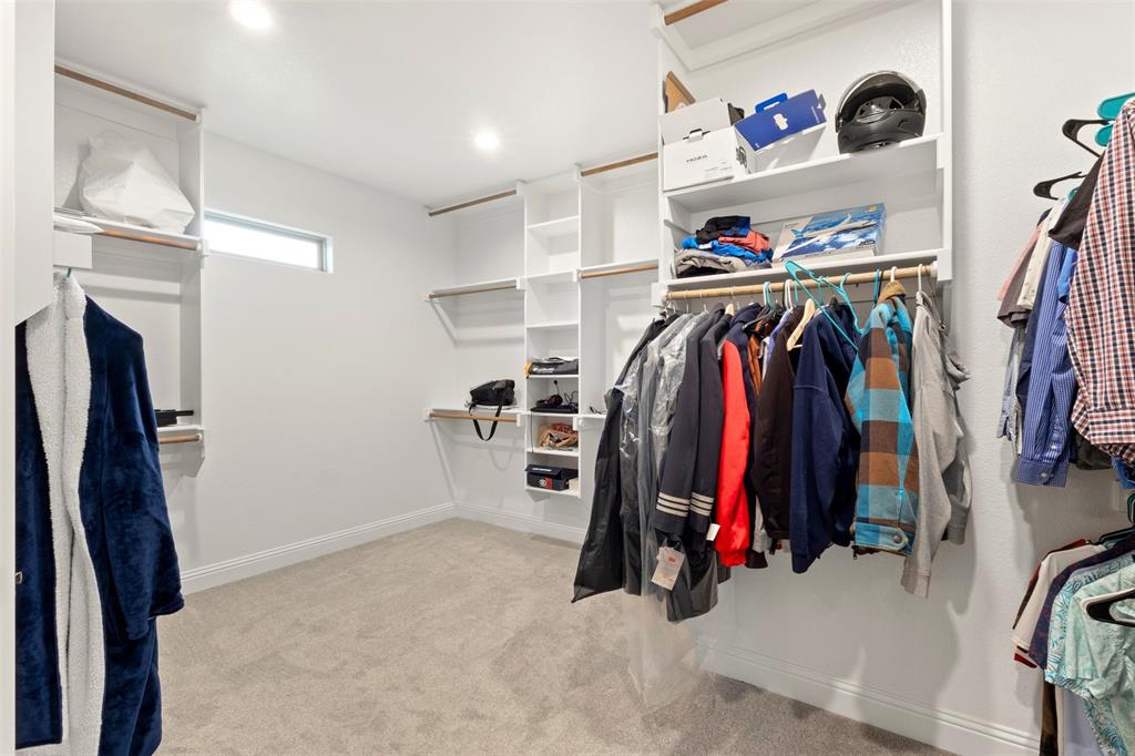 105 Clayton Crossing Springtown, TX 76082 - Photo 18 of 40 a view of walk in closet with clothes